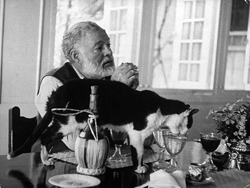 Hemingway drinking and writing Hemingway drinking and writing
