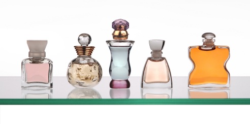 perfume bottles on glass shelf from istockphoto